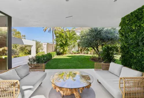 Covered terrace lounge facing the garden